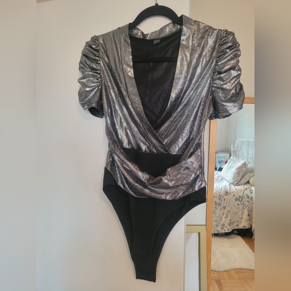 Brand new, never worn silver tone body suit